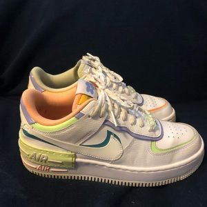 Size 8 in women’s. Nike Air Force 1s with a thick platform.